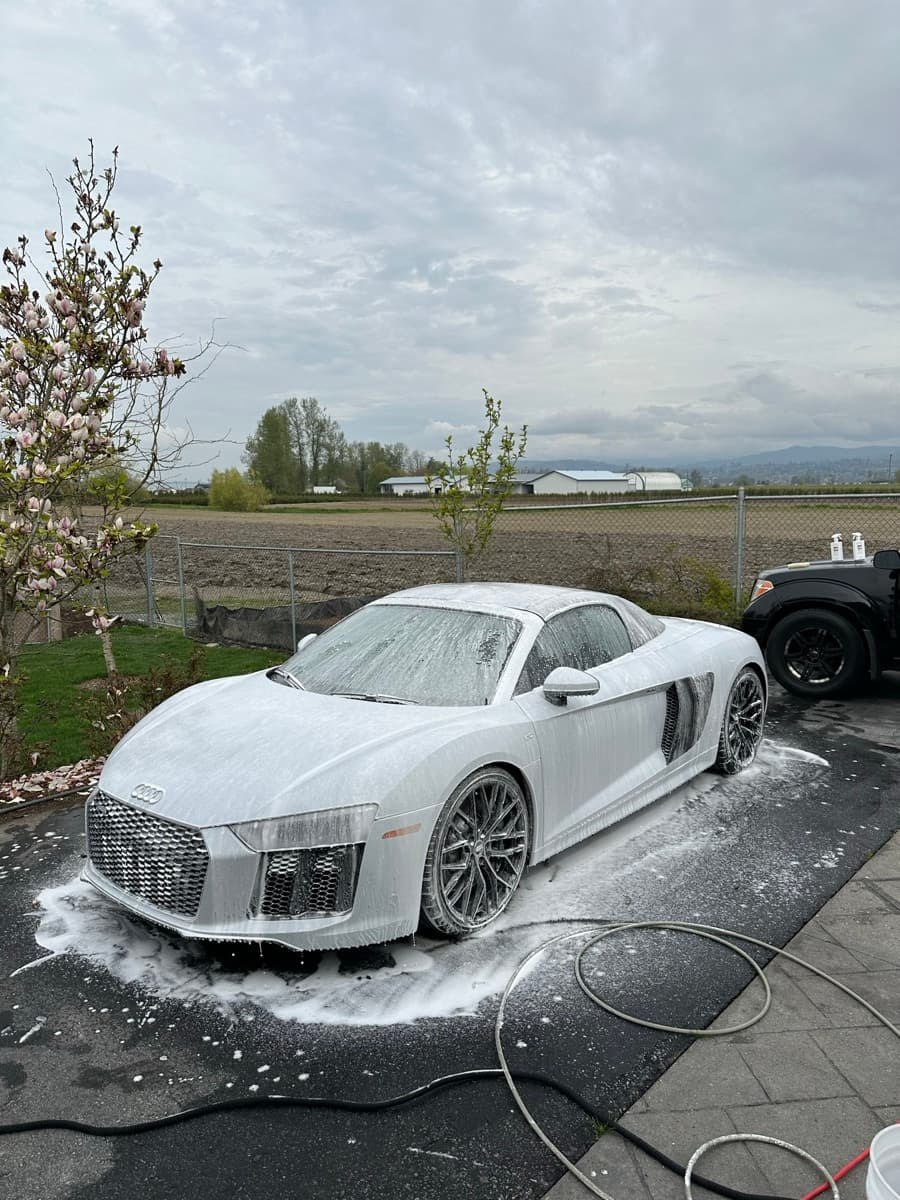 Audi R8 before detailing, covered in foam